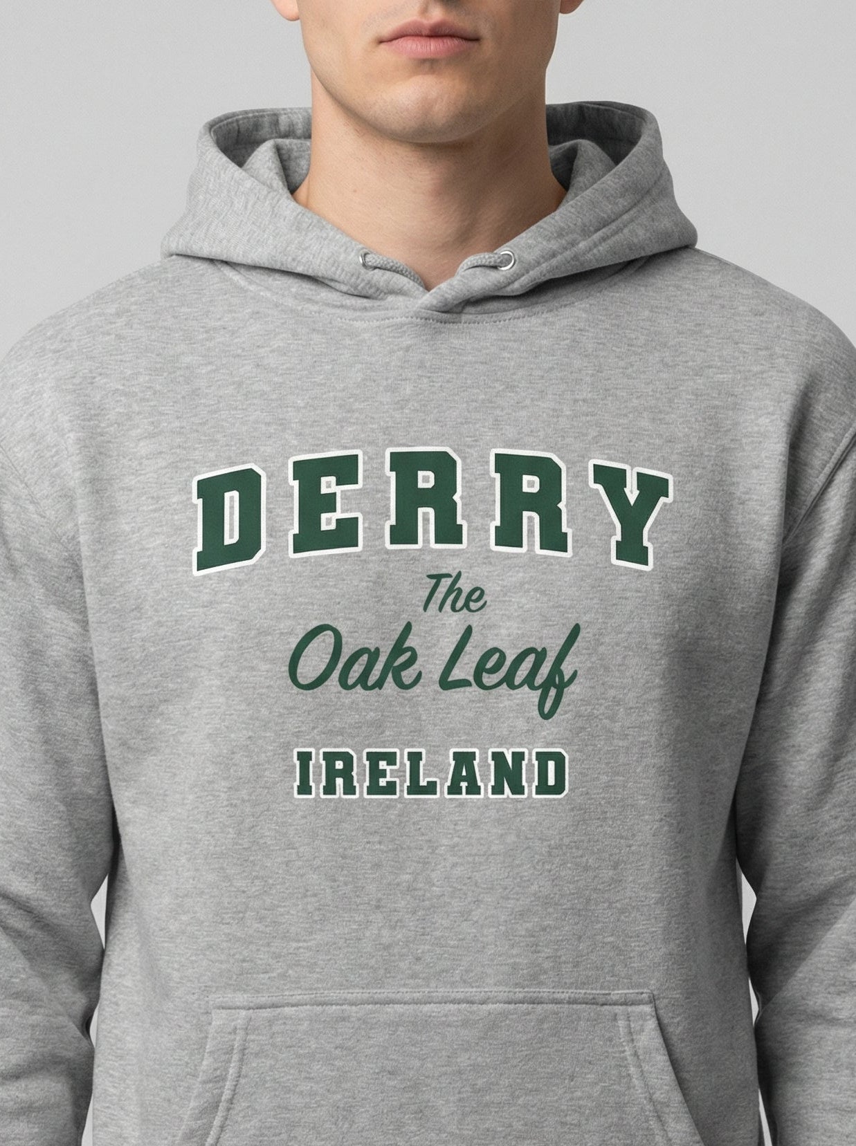 Gray hoodie with 'Derry The Oak Leaf Ireland' text on a plain background