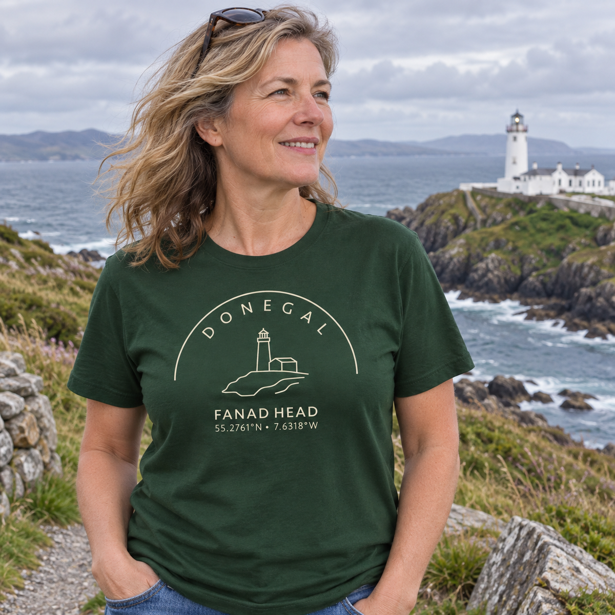 Woman wearing Donegal Fanad Head forest green T-shirt near Fanad Head Lighthouse