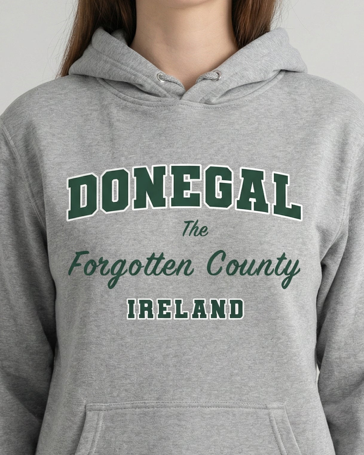 Gray hoodie with 'DONEGAL The Forgotten County IRELAND' text on a plain background