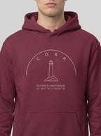 Maroon hoodie with a lighthouse design on a white background