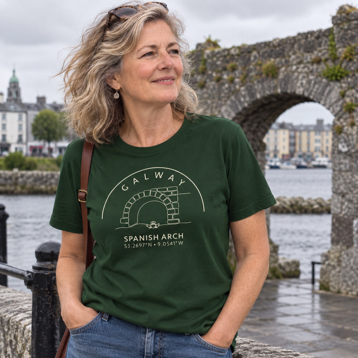 Woman wearing Galway Spanish Arch & Claddagh forest green T-shirt