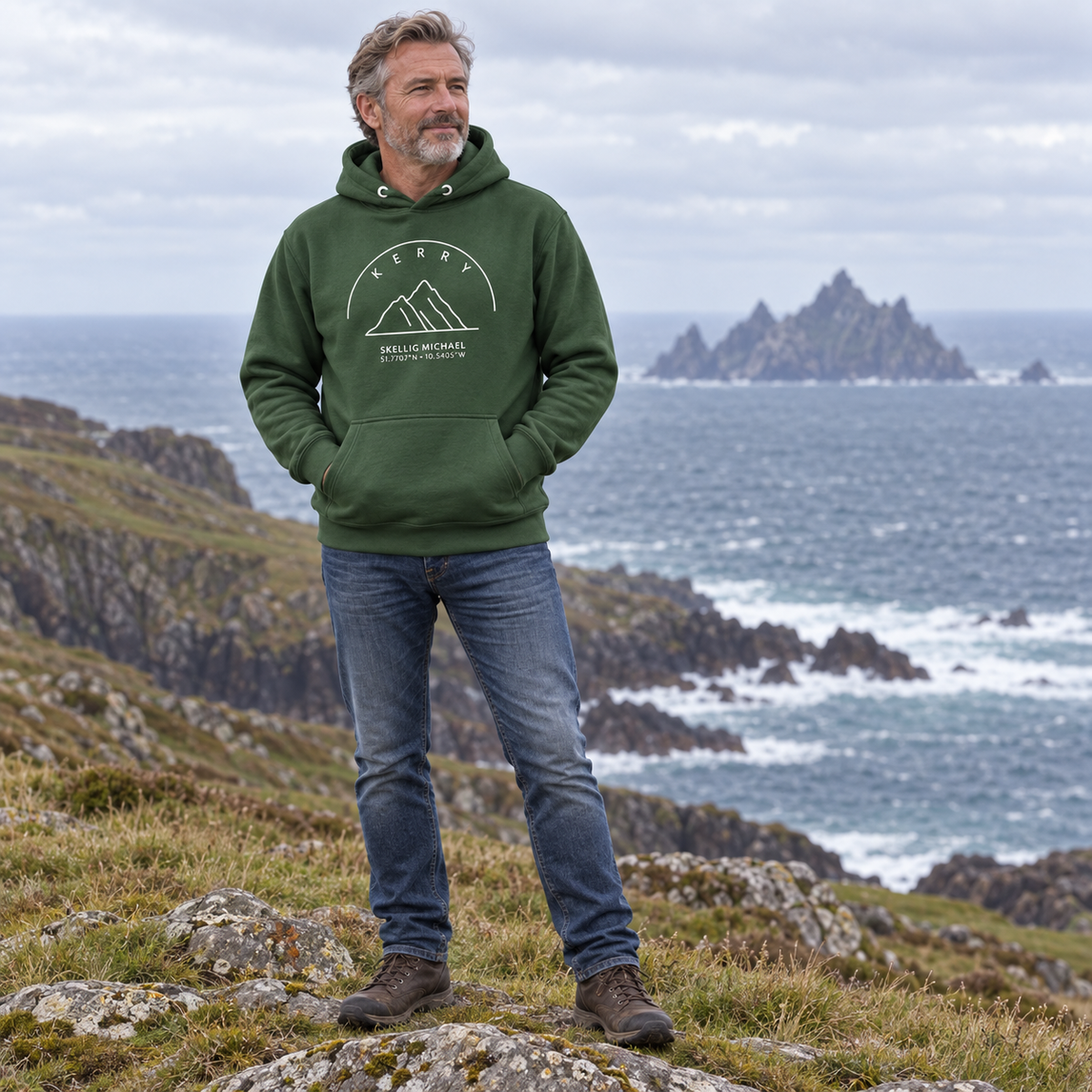 Man wearing the Kerry Skellig Michael forest green hoodie on the Kerry coast