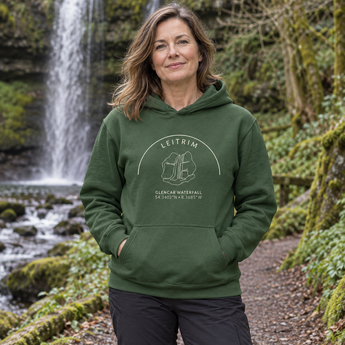 Woman wearing the Leitrim Glencar Waterfall Hoodie in Irish Forest Green