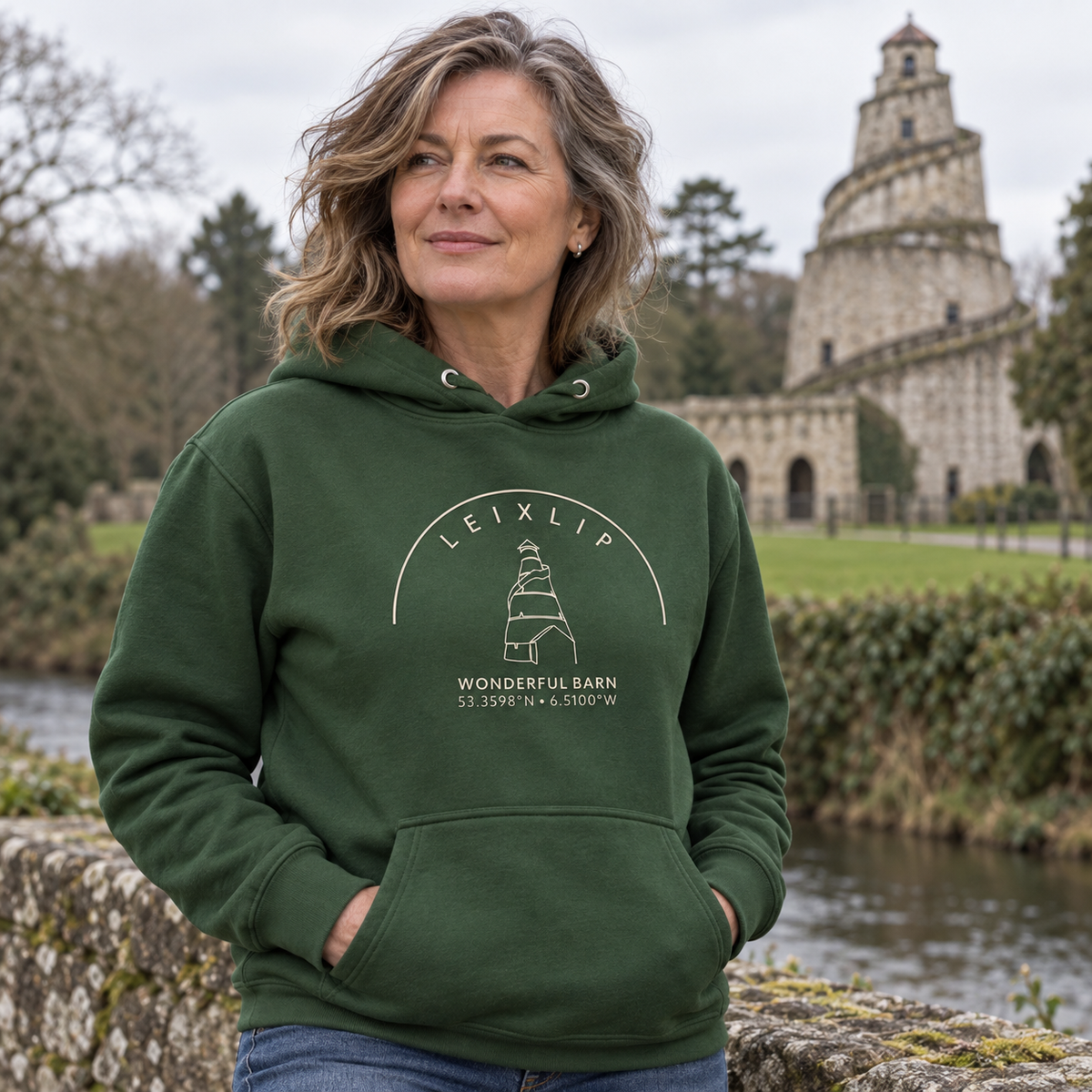 Woman wearing the Leixlip Wonderful Barn forest green hoodie at the Wonderful Barn
