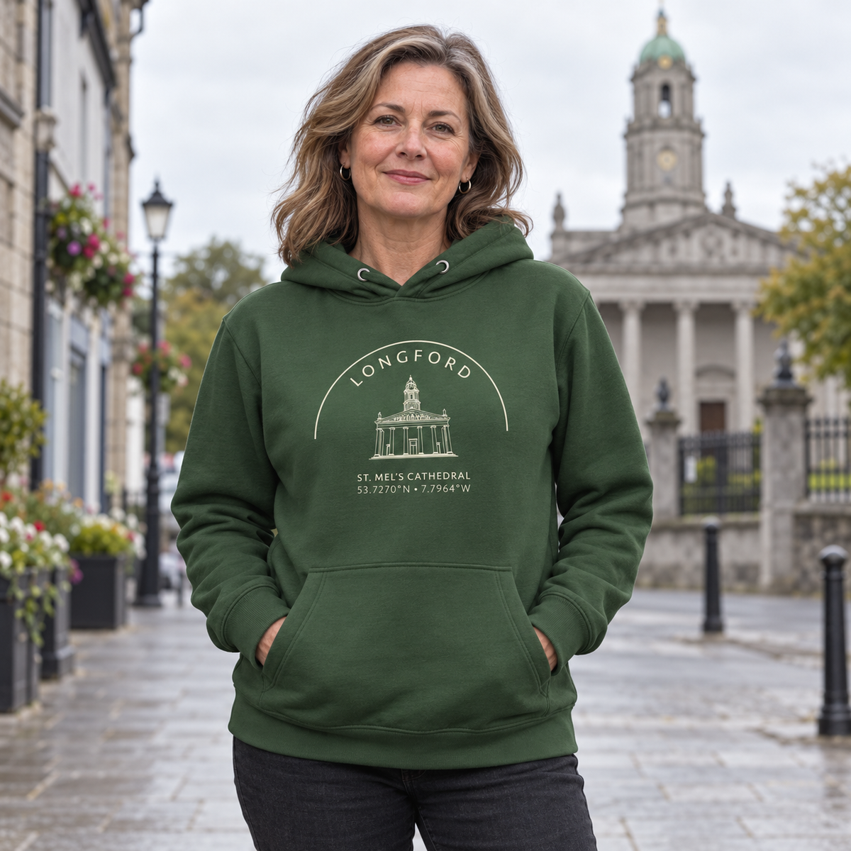 Woman wearing the Longford St. Mel’s Cathedral Hoodie in Irish Forest Green