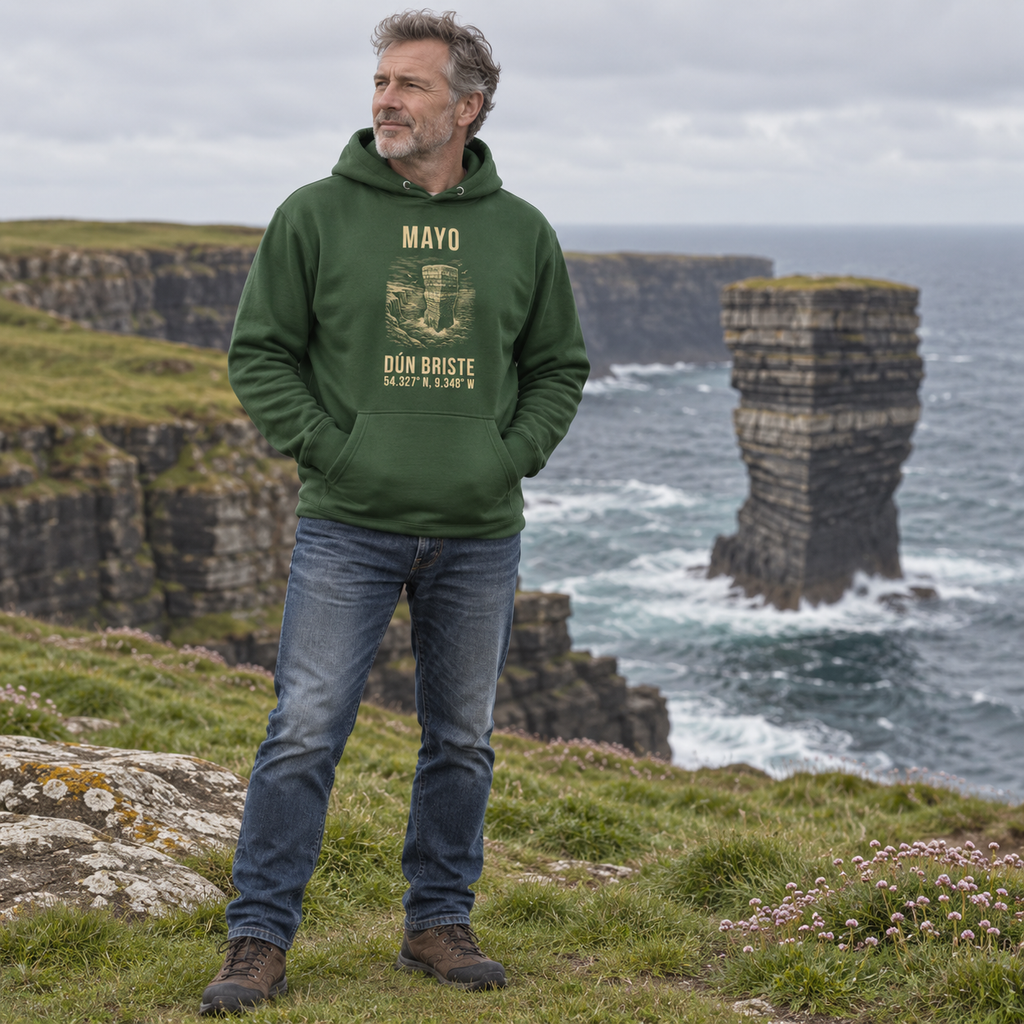Man wearing the Mayo Dún Briste forest green hoodie at Downpatrick Head