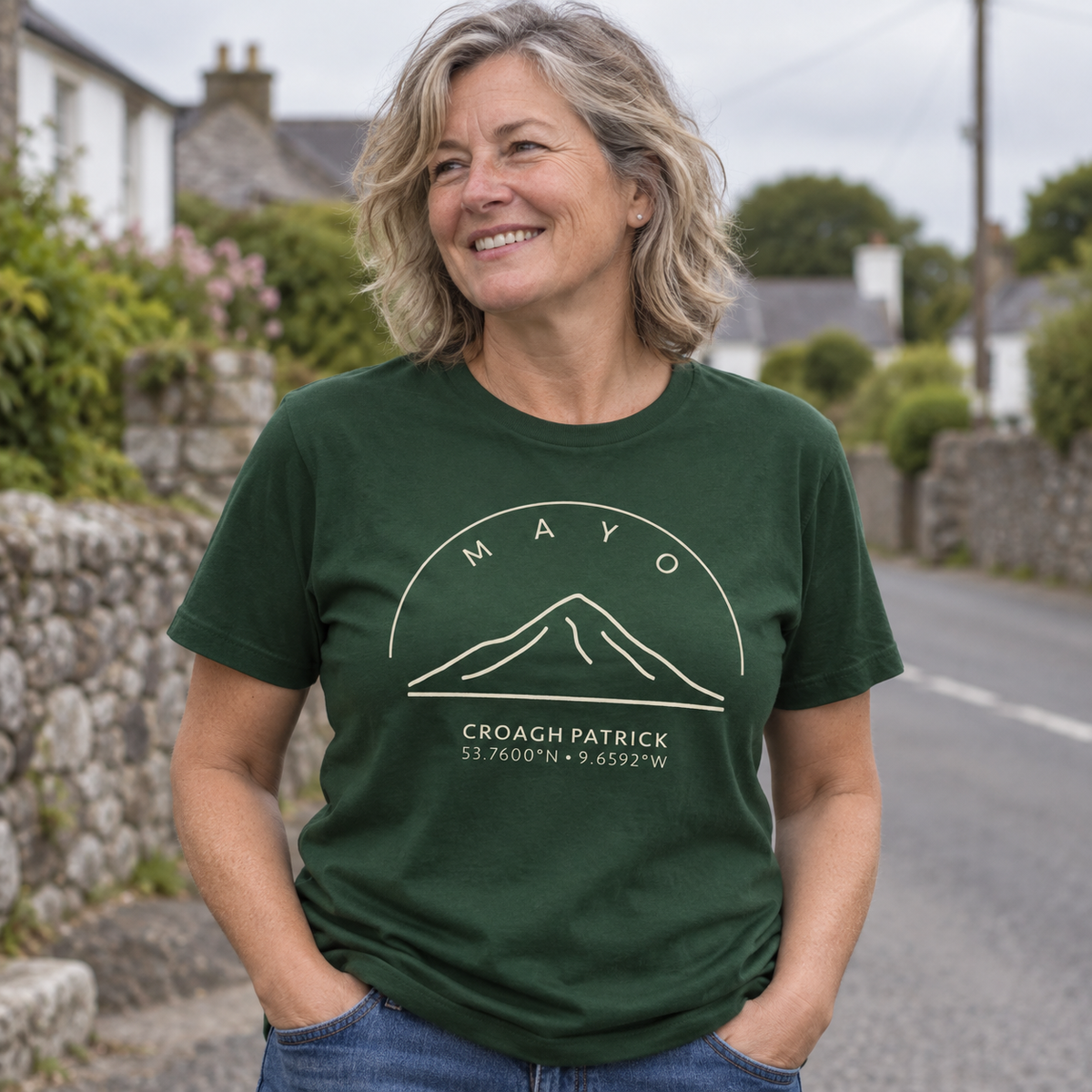 Woman wearing Mayo Croagh Patrick forest green T-shirt in a local setting