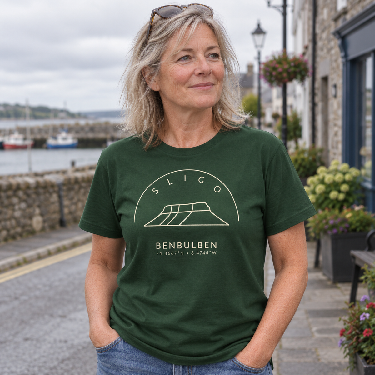 Woman wearing Sligo Benbulben forest green T-shirt in a local setting